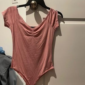 Pink body suit